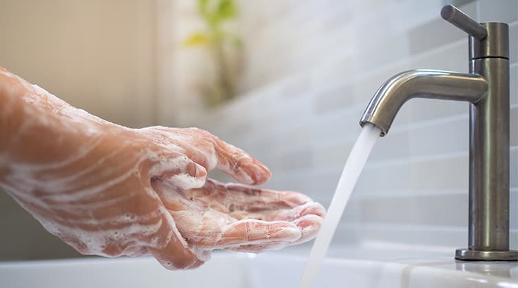 Person washing hands - Tips for Living with a Weakened Immune System